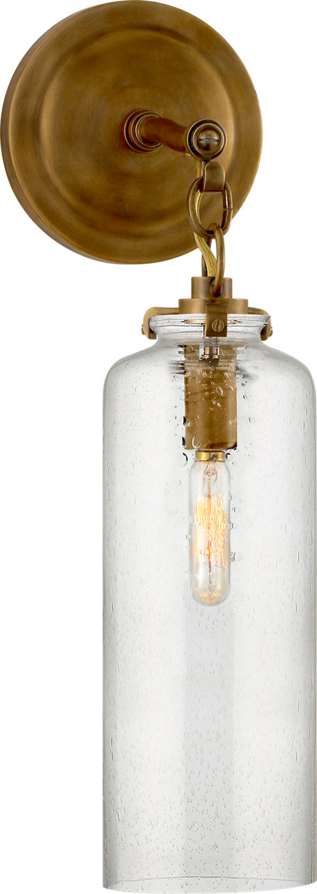 Katie Small Cylinder Sconce in Hand-Rubbed Antique Brass with Seeded Glass