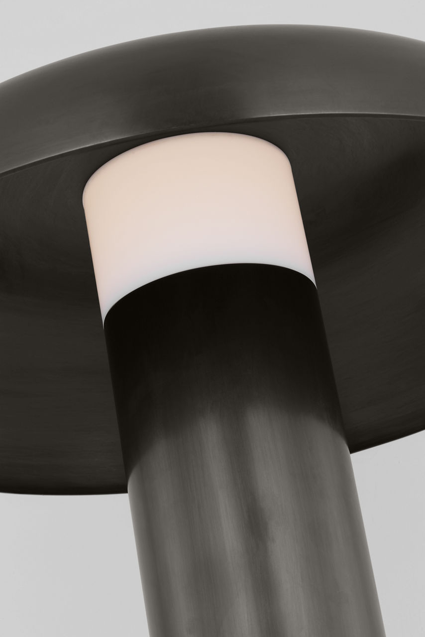 The Louver Medium Table Lamp by Sean Lavin is the epitome of modern elegance and sophistication. Featuring columns of metal with a slight interruption of light, making the metal appear as it's passing through the shade. Louver is crafted with precision and designed to captivate, this exquisite lighting masterpiece is the perfect fusion of contemporary aesthetics and exceptional functionality. - alternate view