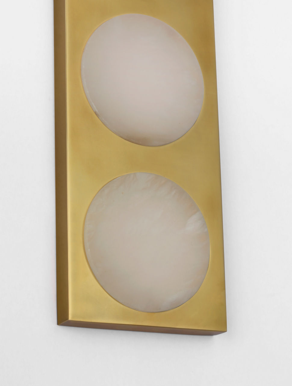 The Dichotomy sconce makes a bold architectural statement with its 27-inch height and six-light configuration. Antique-burnished brass paired with natural alabaster creates sophisticated ambient lighting perfect for upscale interiors. - alternate view
