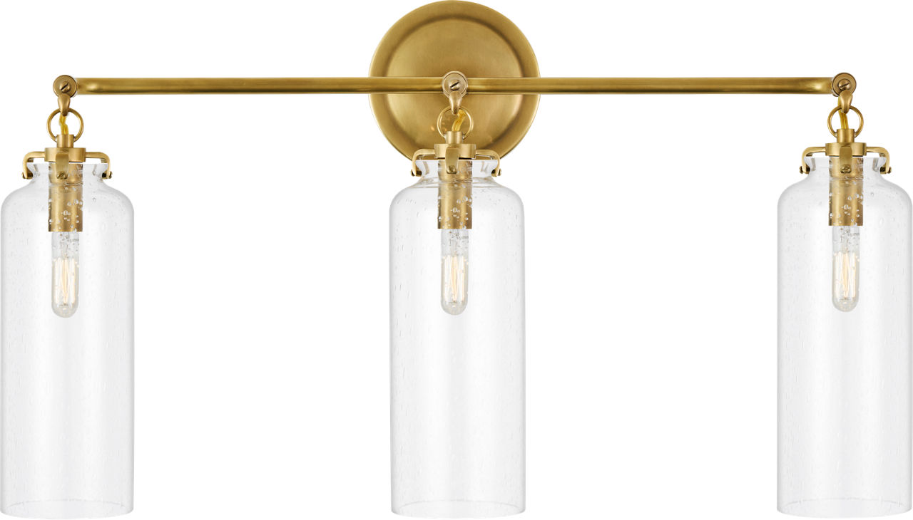 Katie Small Cylinder Triple Sconce in Hand-Rubbed Antique Brass with Seeded Glass